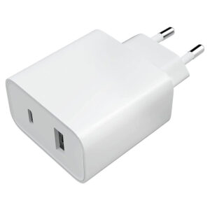 Xiaomi 33W wall charger with dual Type-A and Type-C ports plugged into a wall outlet